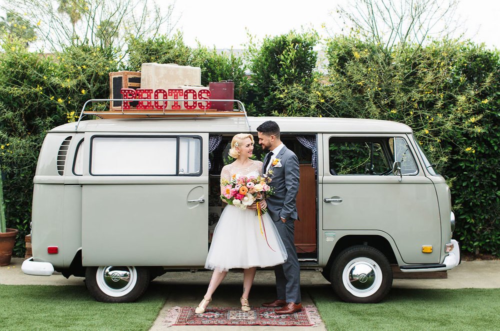 Bride and Groom posing with VW van at Ruby Street 