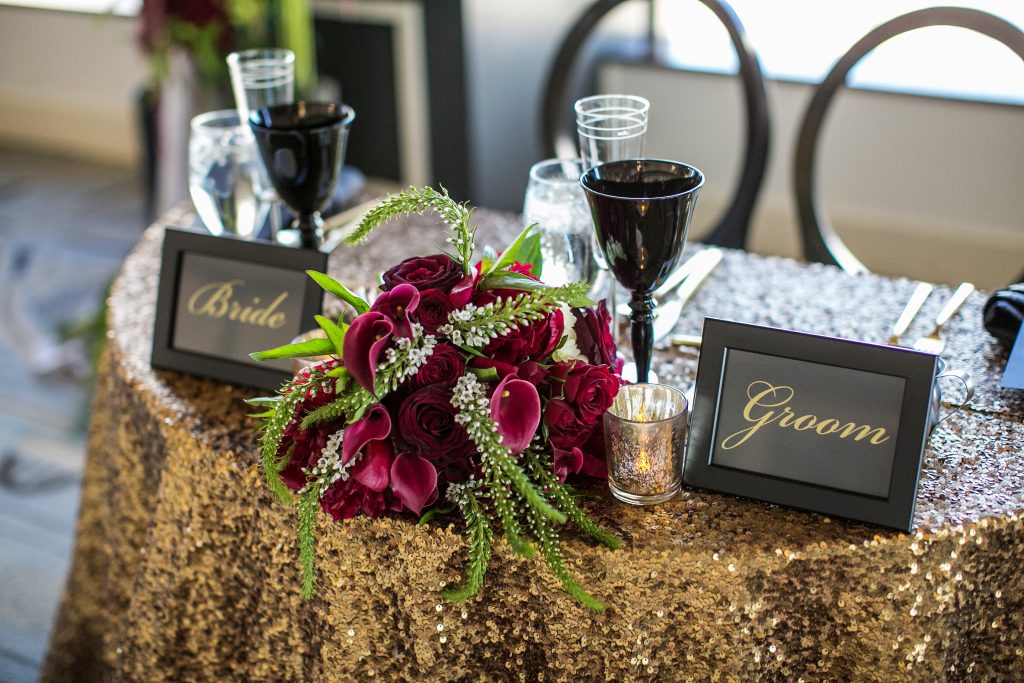 Sweetheart table with rentals and signage at City Club Los Angeles