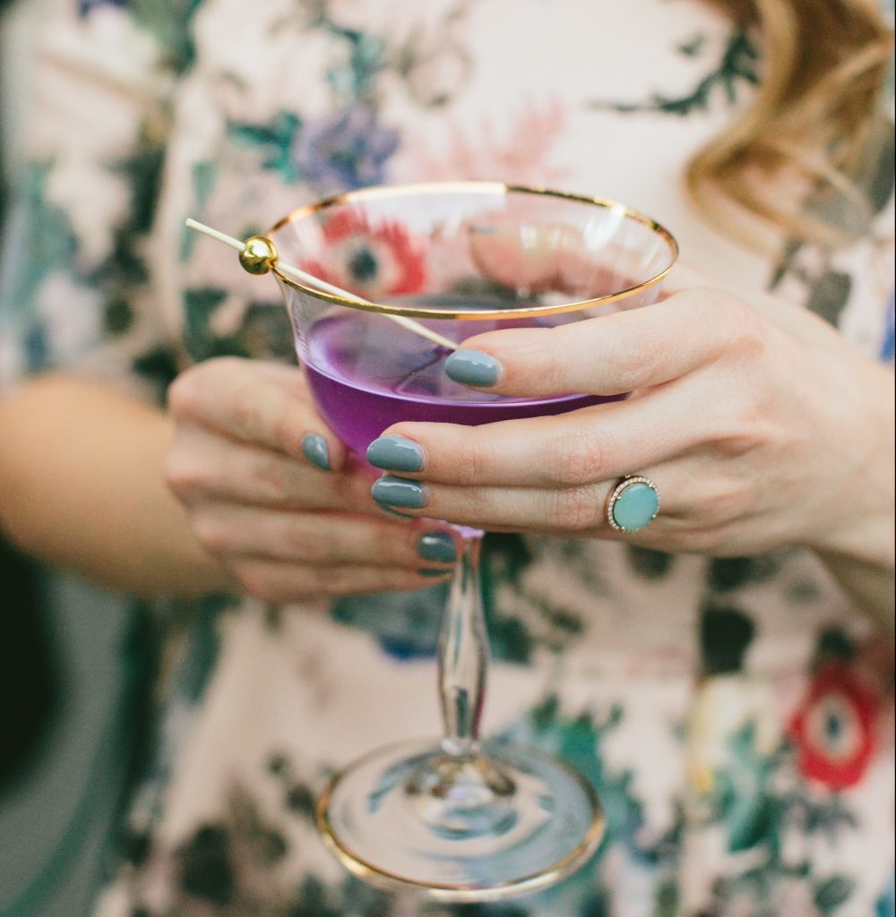 purple-cocktail-in-hand