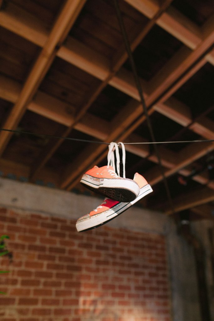 shoes hanging off wire