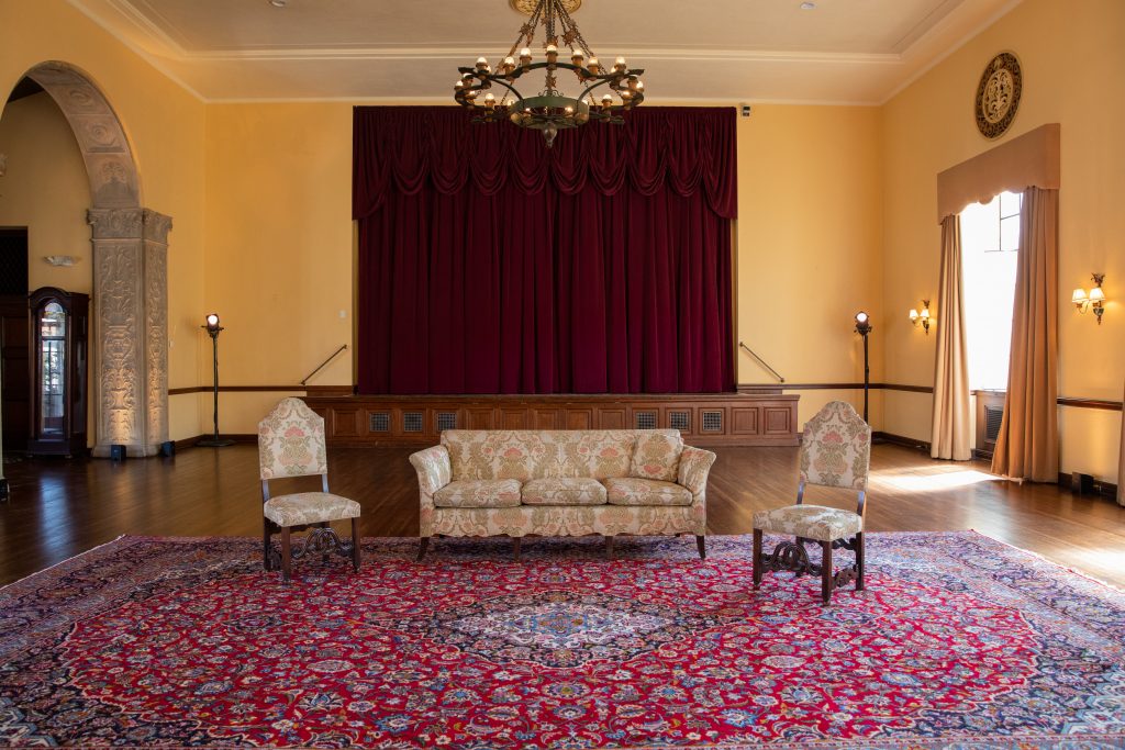 Ebell stage with red curtains
