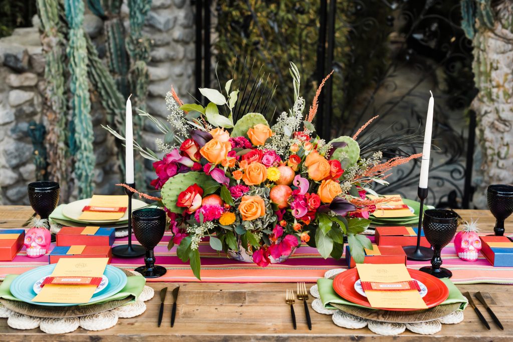 colorful fiesta tablescape with floral centerpiece